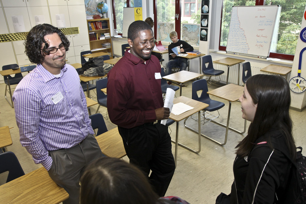 A student talking with a university adviser about a visa application